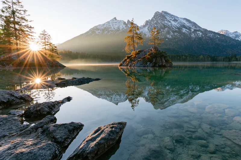 The Lake at Sunrise with Rocky Island and Mountain Peaks