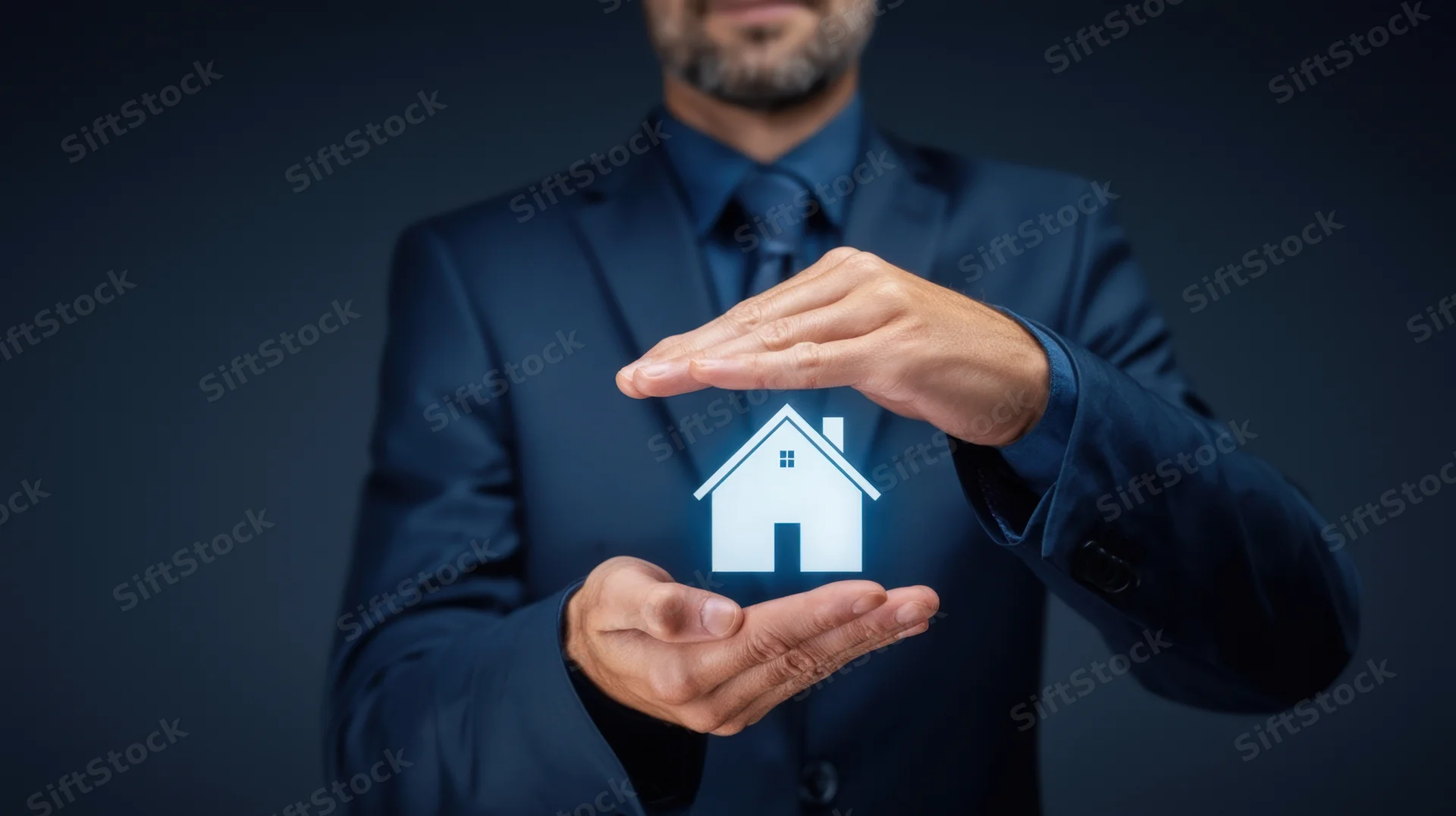Man in suit holding holographic house icon with hands in protective gesture against dark background