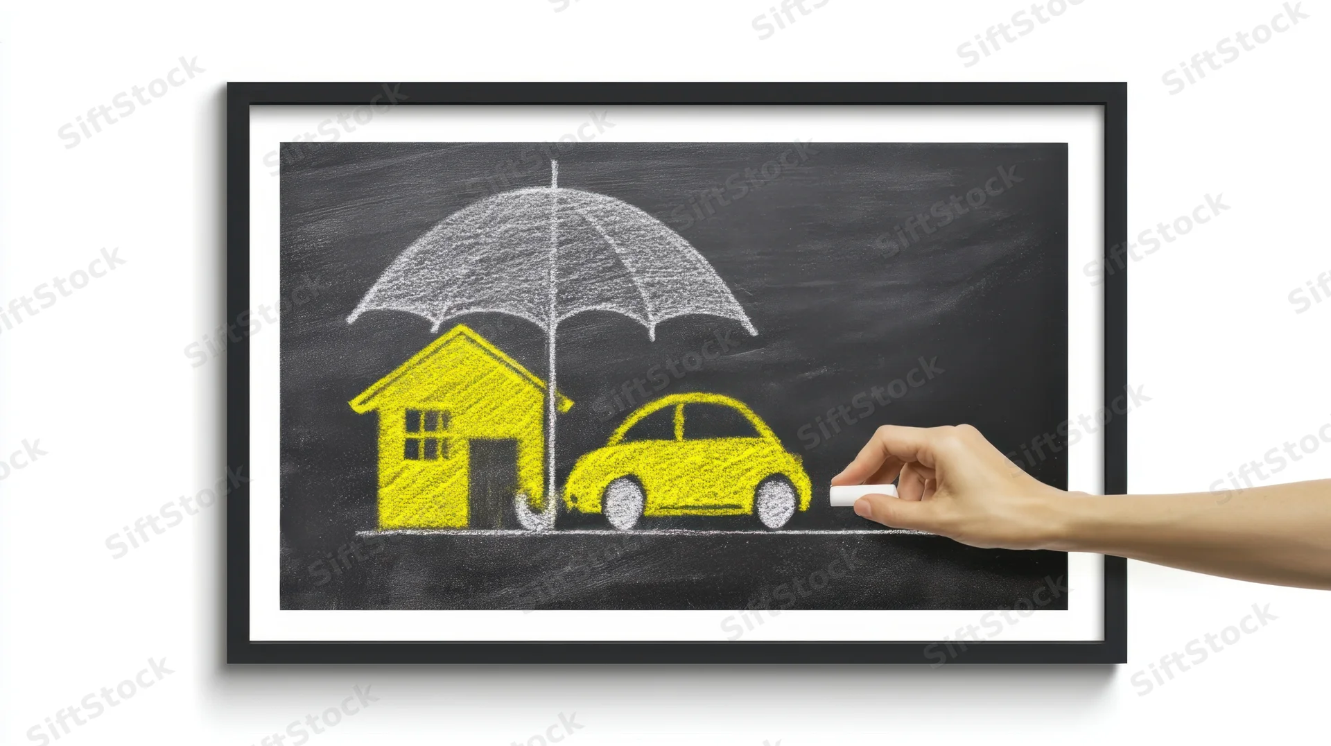 Hand drawing a yellow house and car under a white umbrella on a chalkboard framed in black