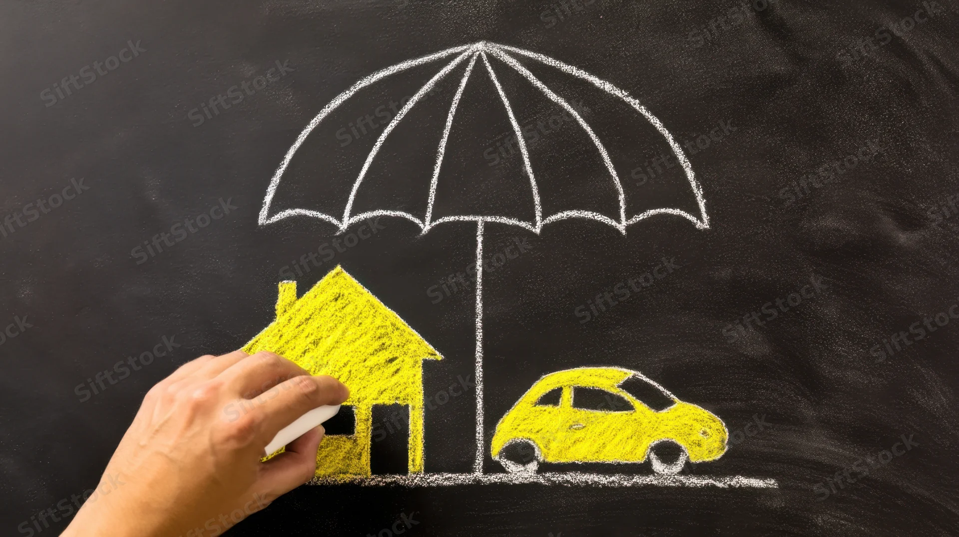 Hand drawing a yellow house and car under a white umbrella on a blackboard