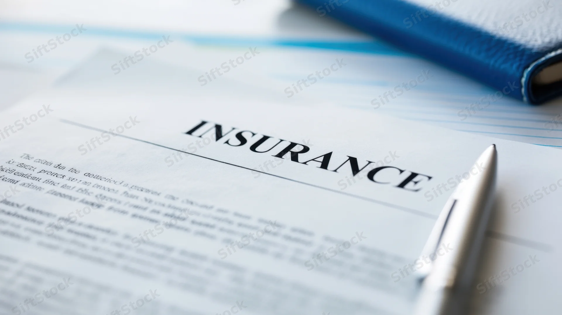 Insurance document with pen on desk