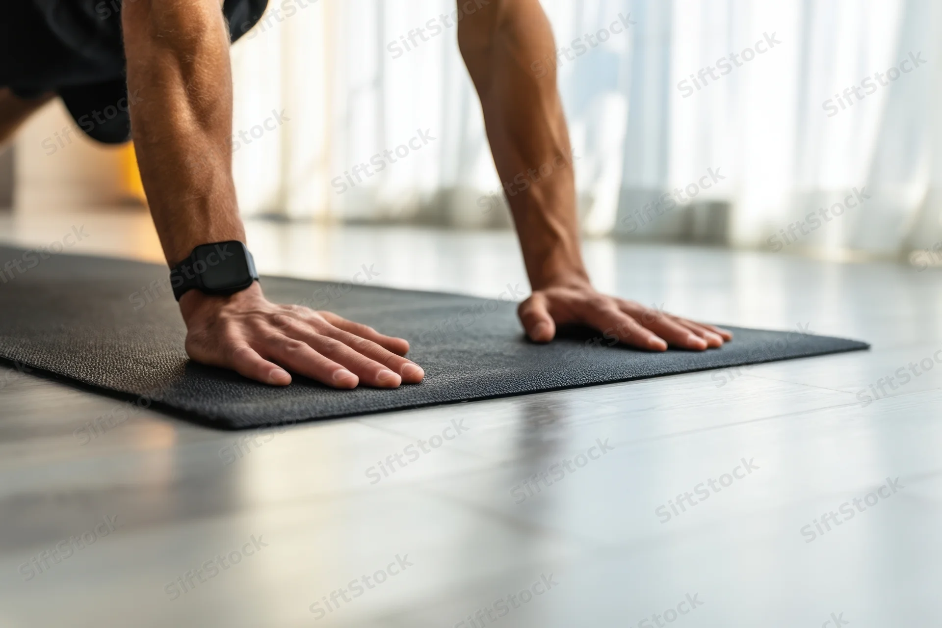 Man doing pushup on exercise mat in home gym setting