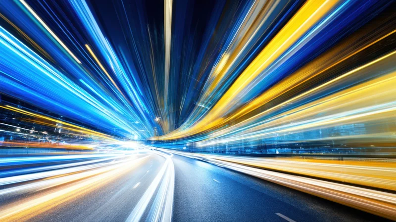 Dynamic light trails from moving vehicles on a highway at night