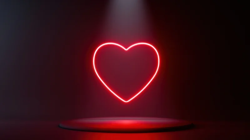 Glowing red neon heart outline on a circular platform under spotlight in dark space