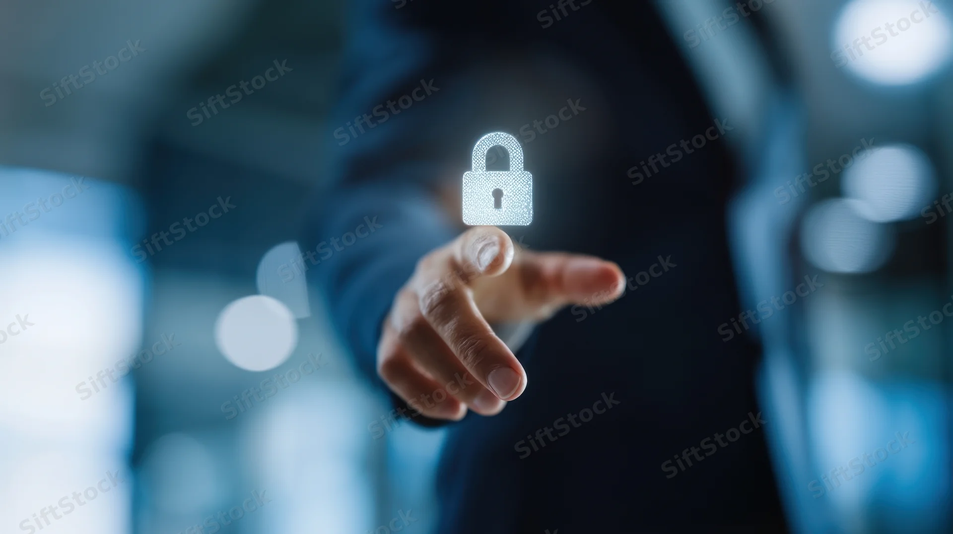 Hand touching a glowing digital lock in a corporate office setting