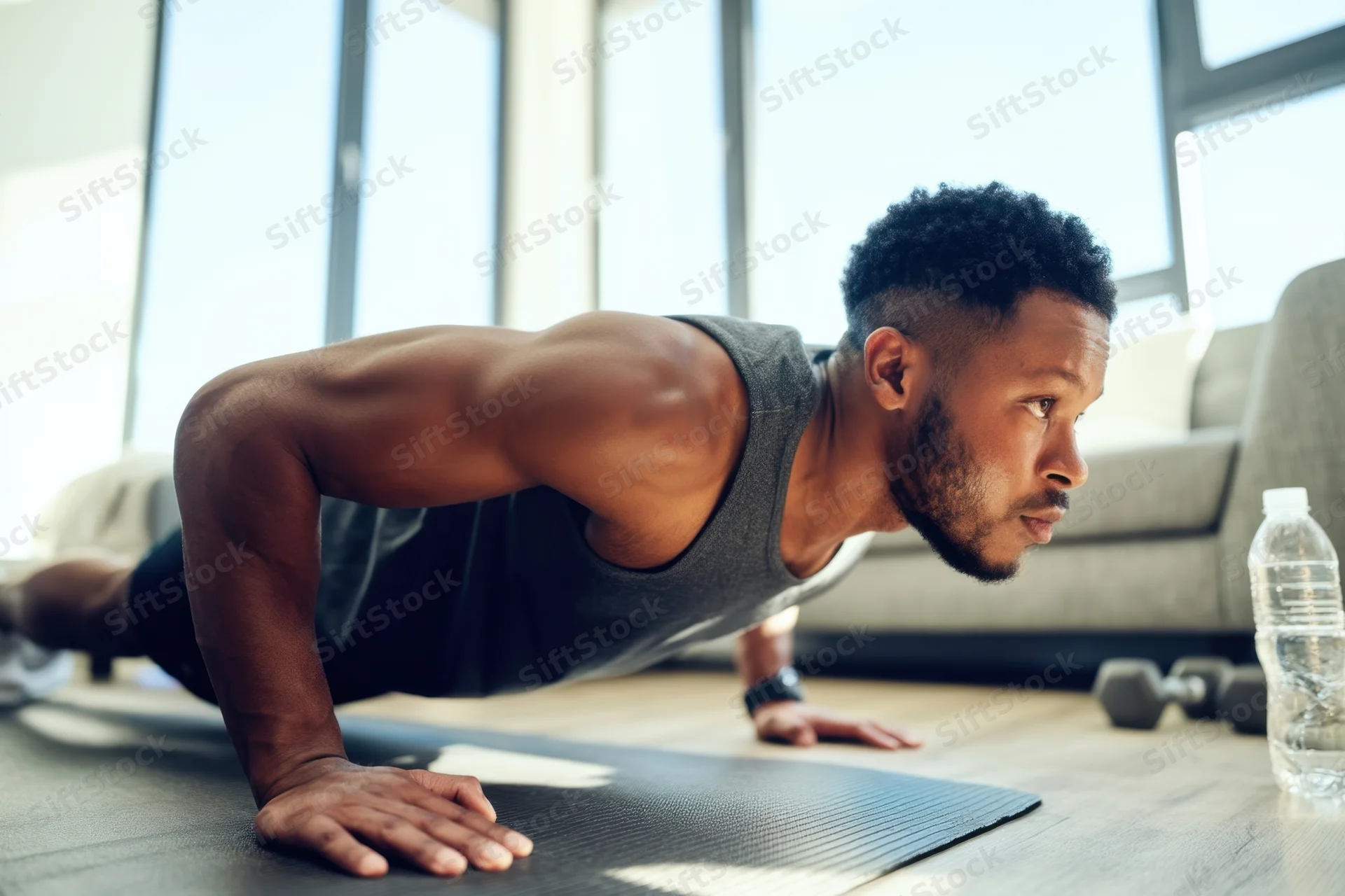 Man doing pushup on exercise mat in living room