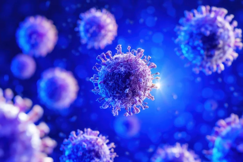 Coronavirus particles floating in a blue glowing background