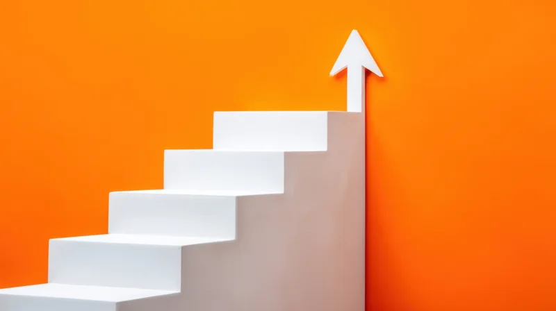 White staircase with upward arrow against orange background
