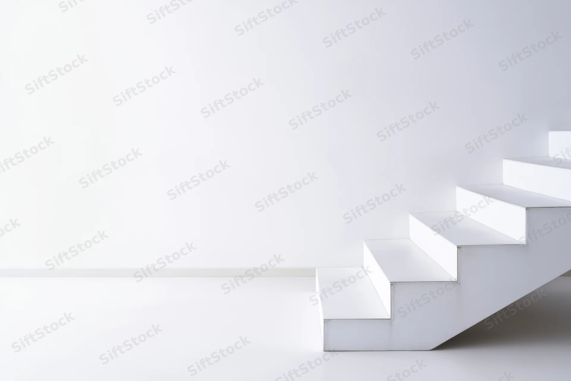 White staircase ascending in a minimalist interior with copyspace
