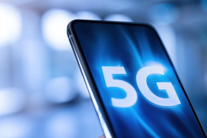 Smartphone screen displaying 5g text against a blue glowing background