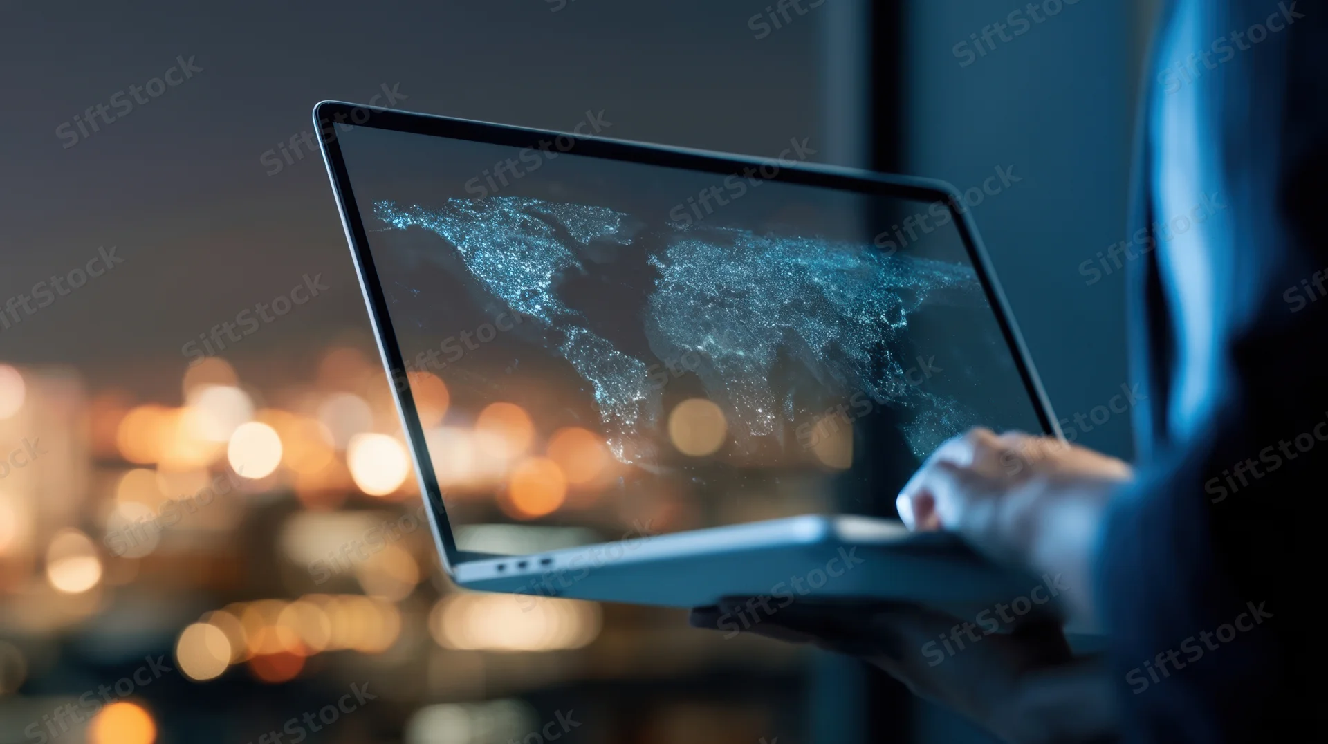 Woman holding laptop with digital world map on screen at night overlooking city lights