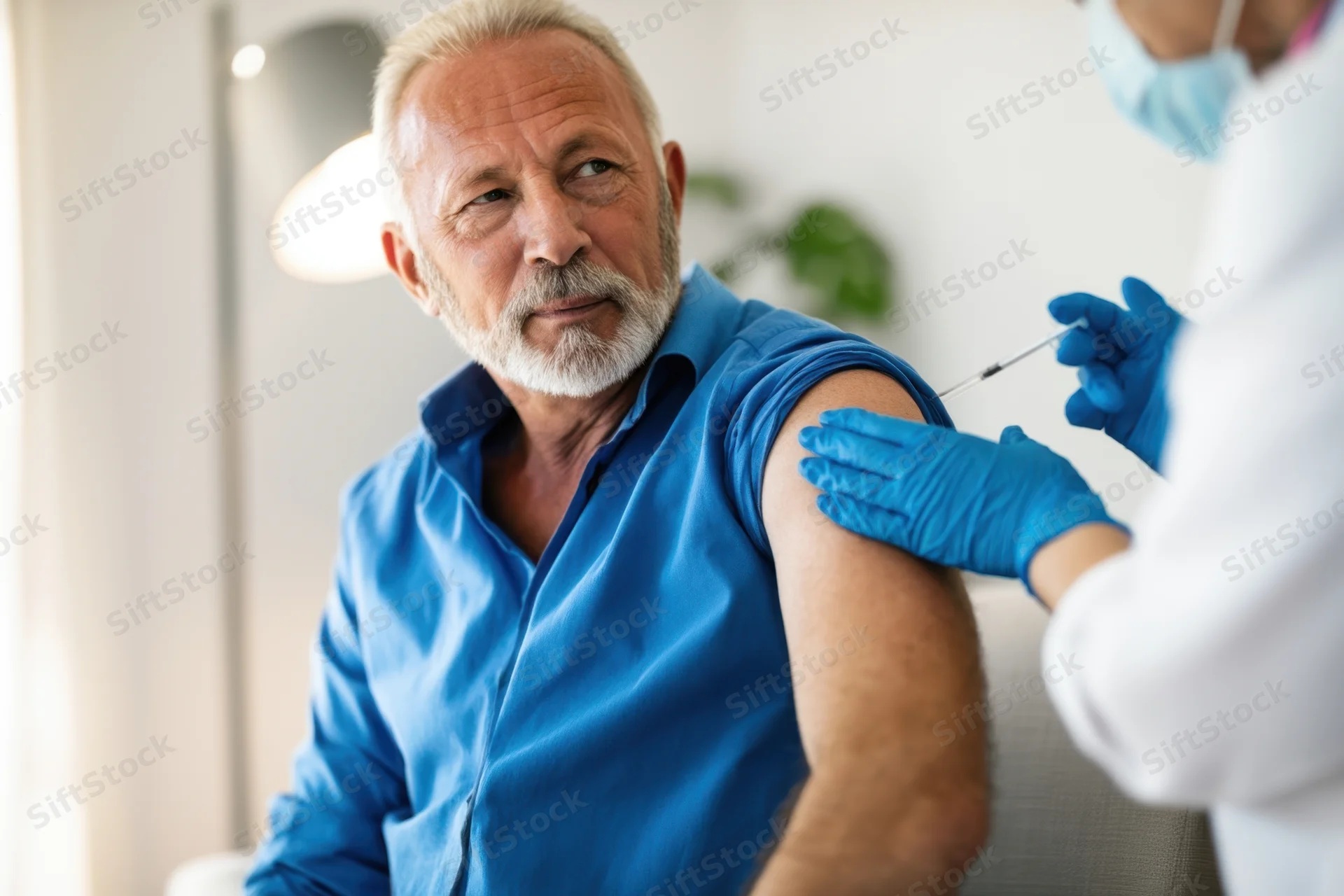 Senior man receiving vaccination in a clinic setting