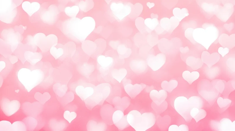 Soft pink background with glowing white hearts in bokeh effect