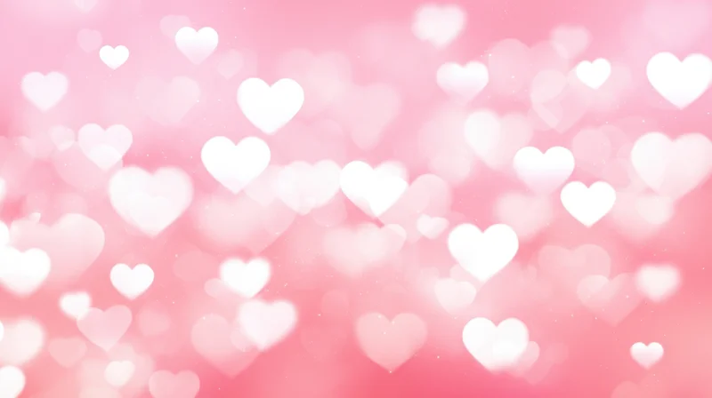 Soft pink background with white heart bokeh lights and sparkles