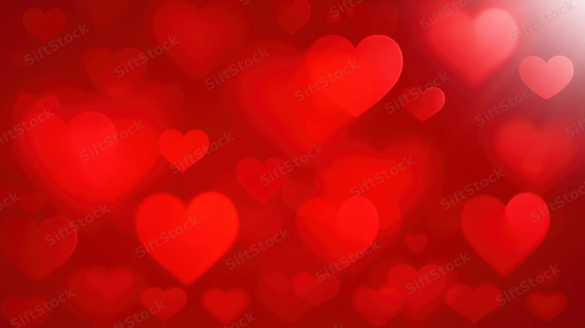 Red hearts floating in soft focus as a romantic background