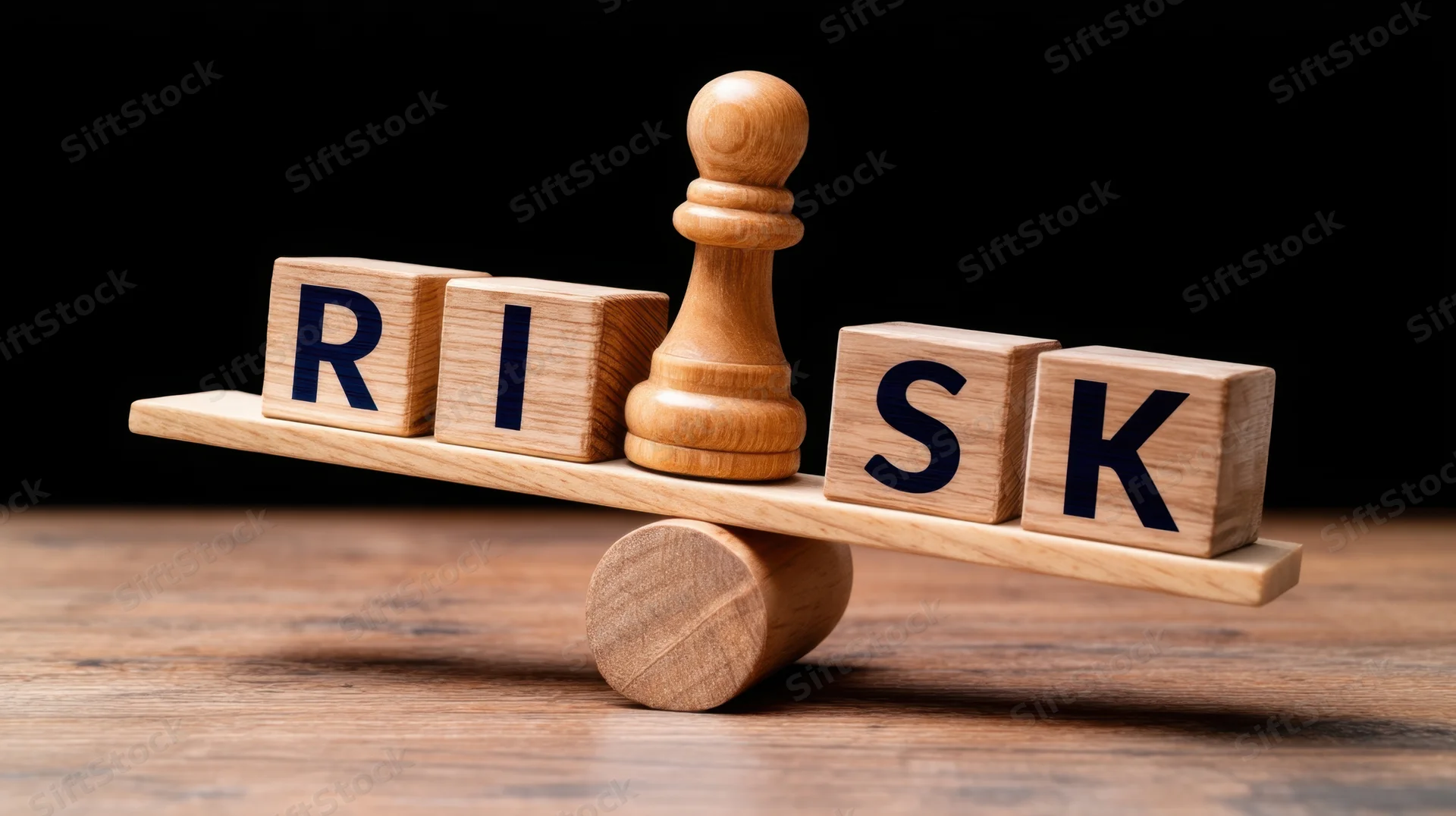 Wooden blocks spelling risk balanced on a seesaw with a chess pawn as fulcrum on a dark wooden surface