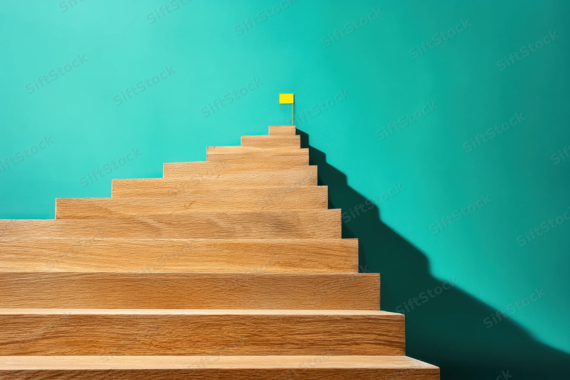 Wooden stairs ascending to a yellow flag against a teal wall