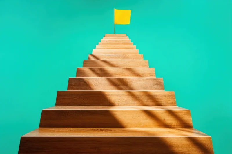 Wooden staircase leading upward with yellow flag at top against teal background