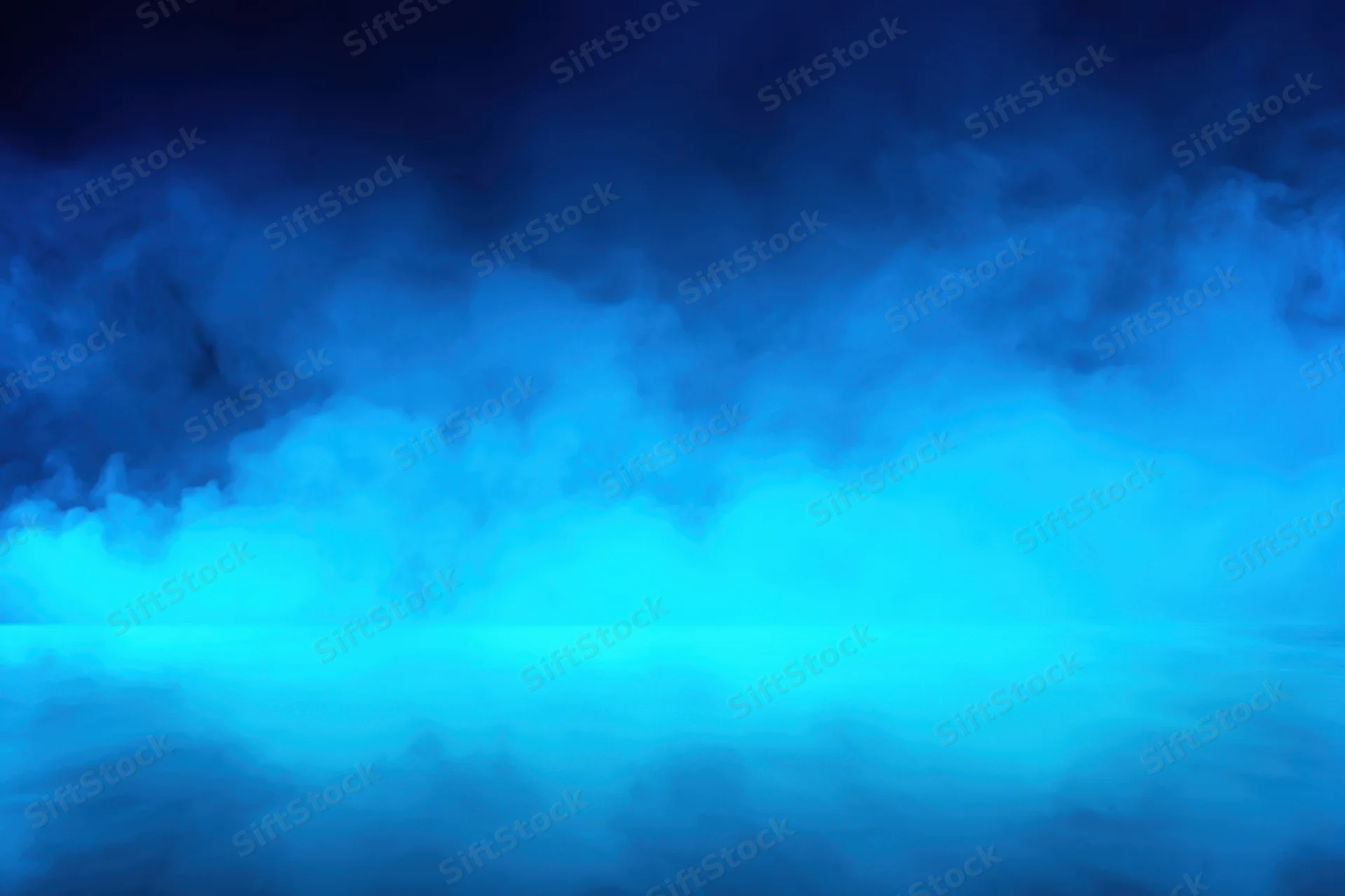 Blue fog filling a studio backdrop with soft light and atmospheric haze