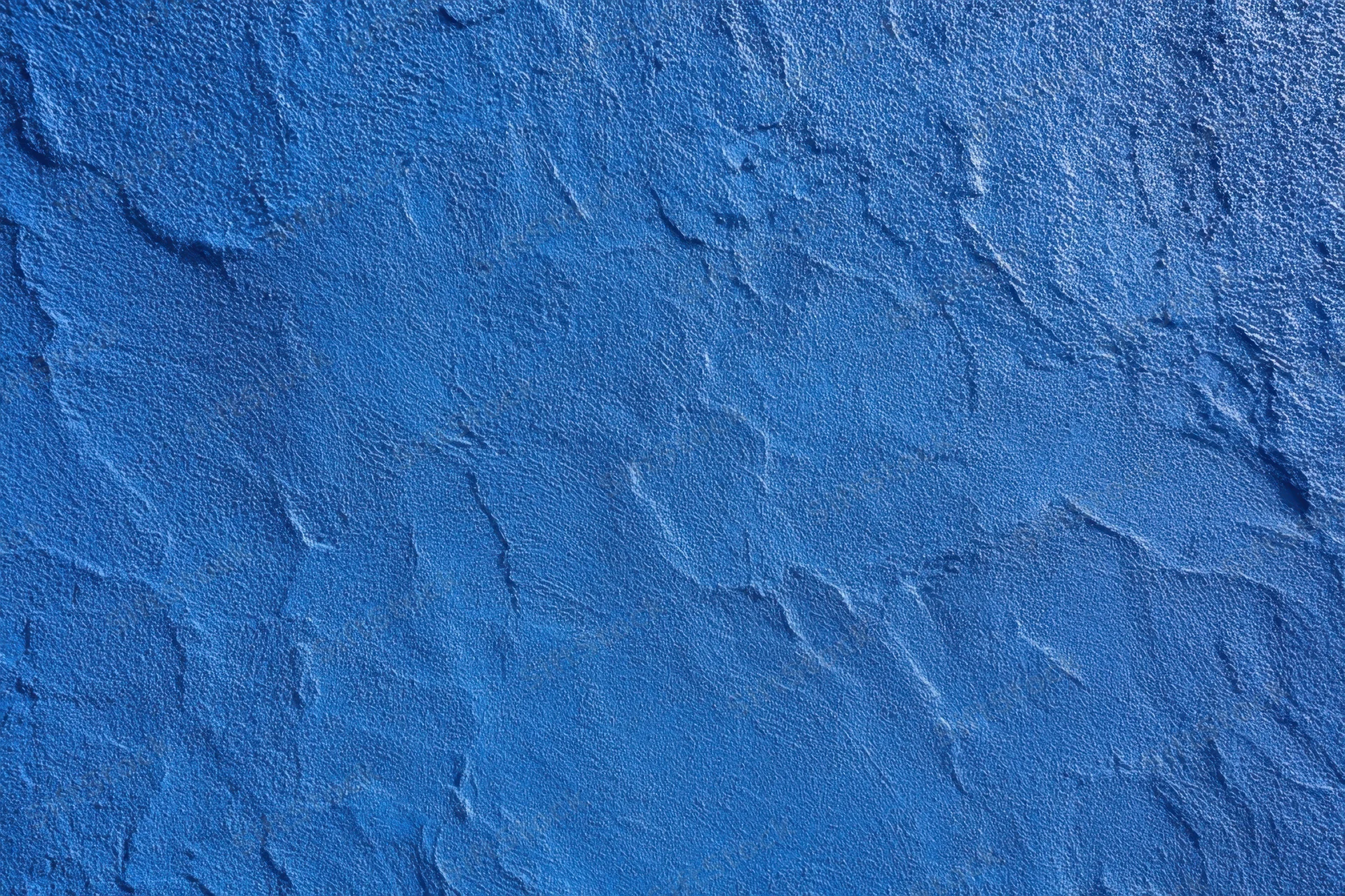 Close-up of blue textured plaster wall surface
