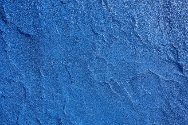 Close-up of blue textured plaster wall surface