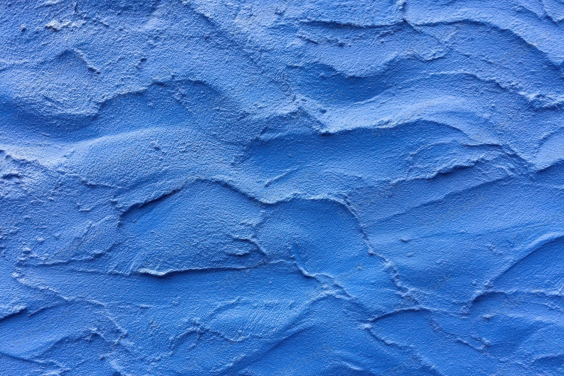 Close-up of blue textured plaster wall surface