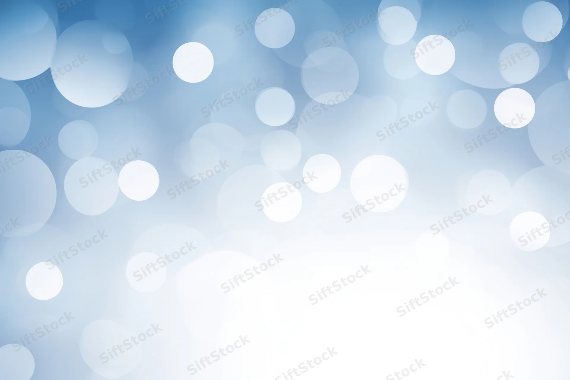 Soft white bokeh lights on a cool blue gradient background