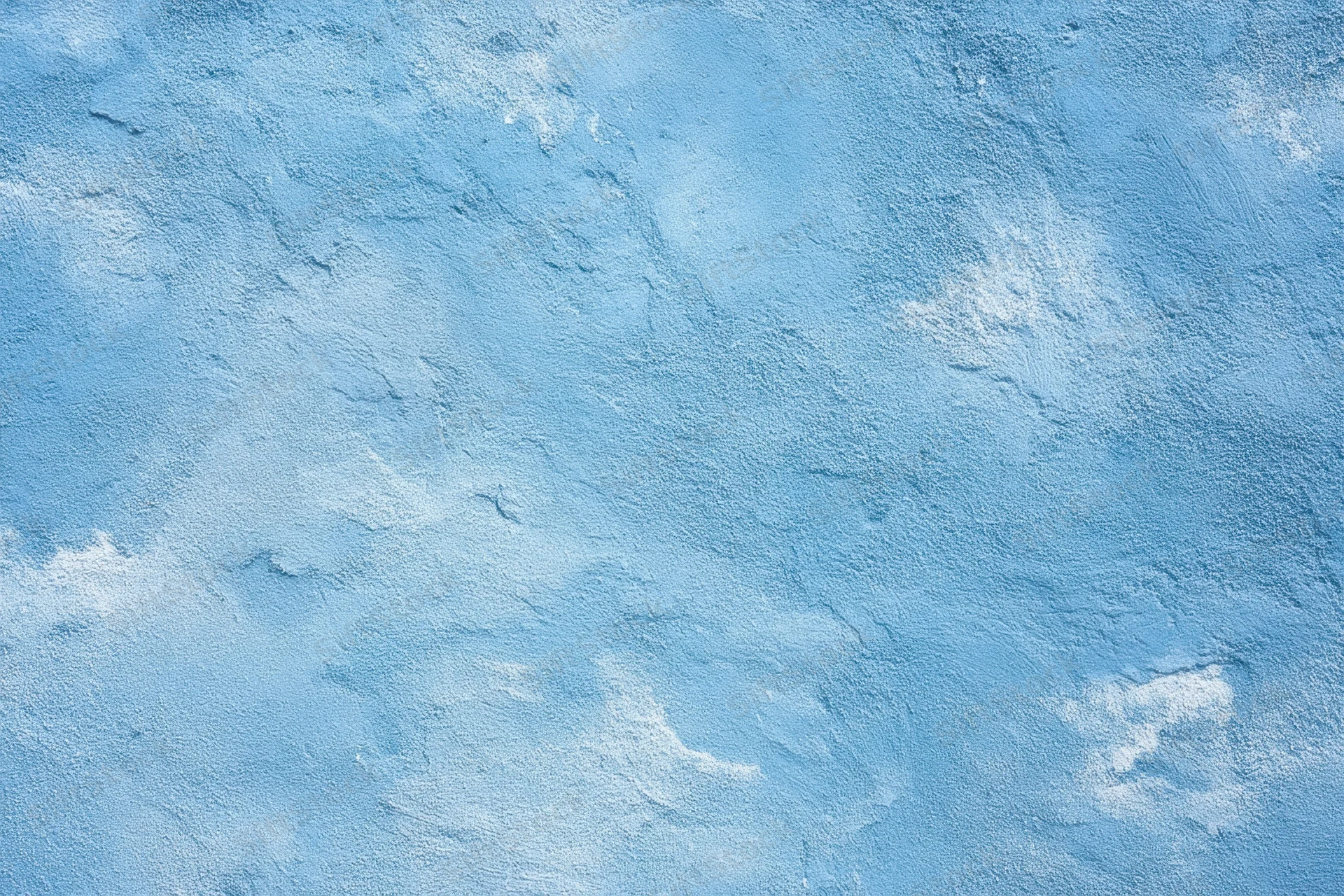 Textured blue plaster wall with white patina and rough surface