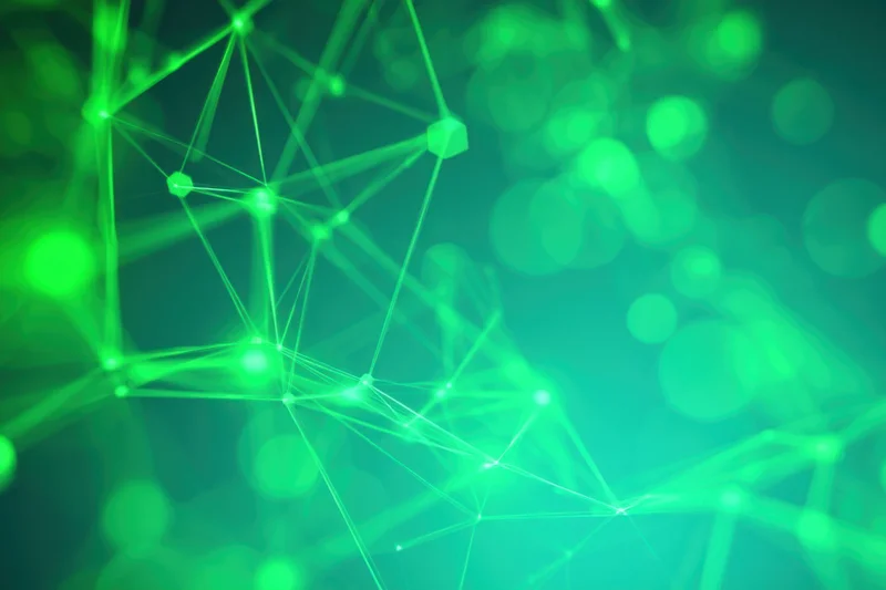Glowing green network of connected nodes against a blurred digital background
