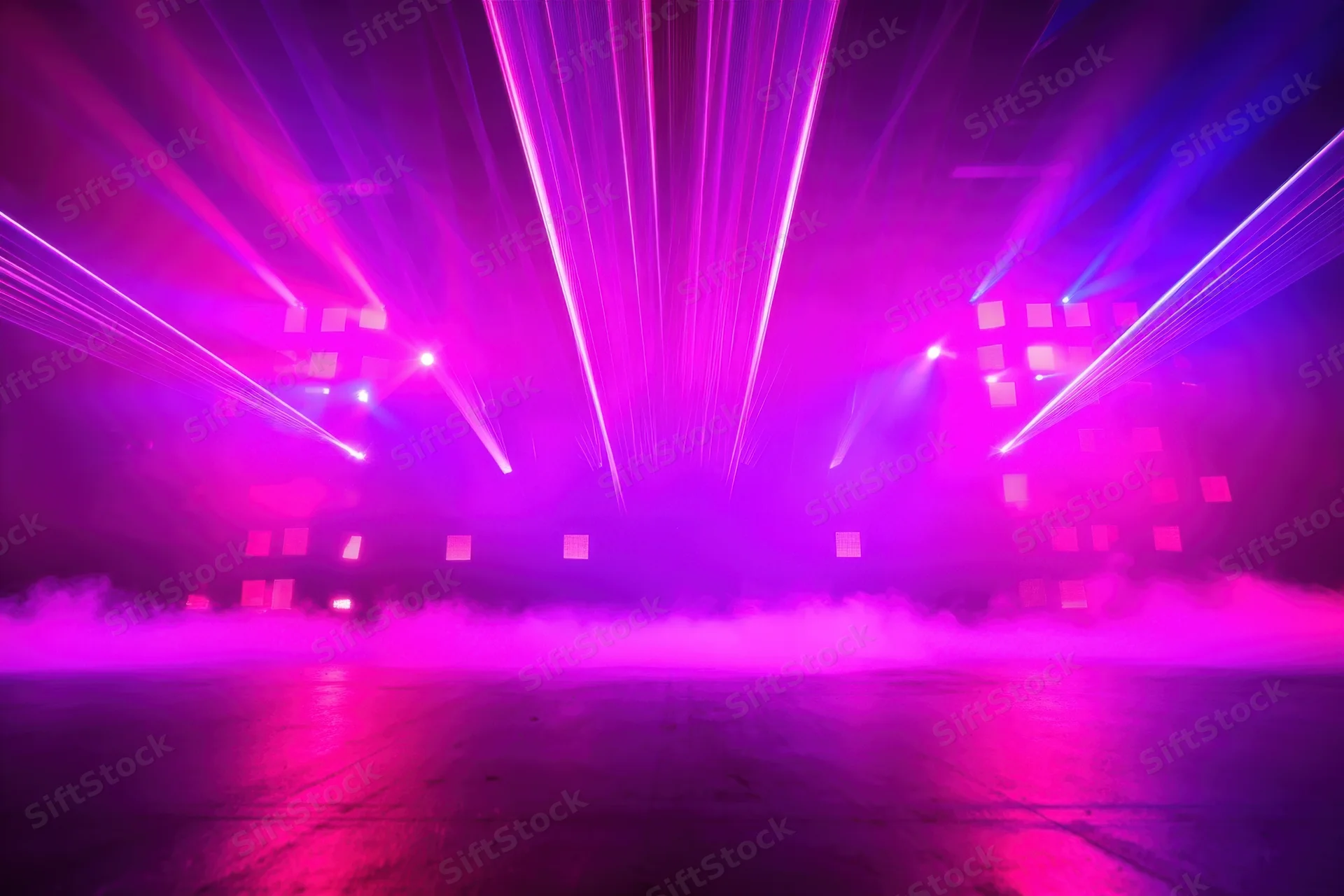 Neon-lit stage with purple and pink laser beams and fog over concrete floor