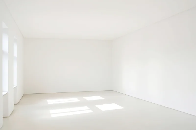 Empty minimalist white room with natural light and copyspace on floor