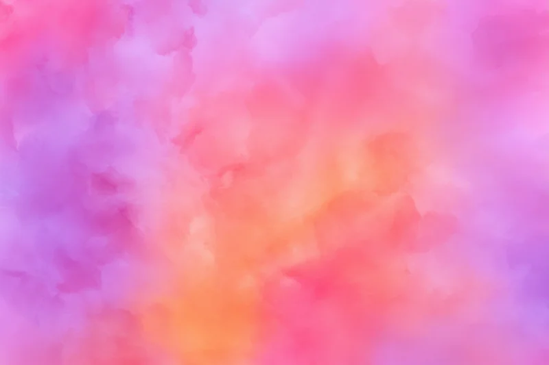 Soft pink purple and orange gradient blending in a watercolor abstract background