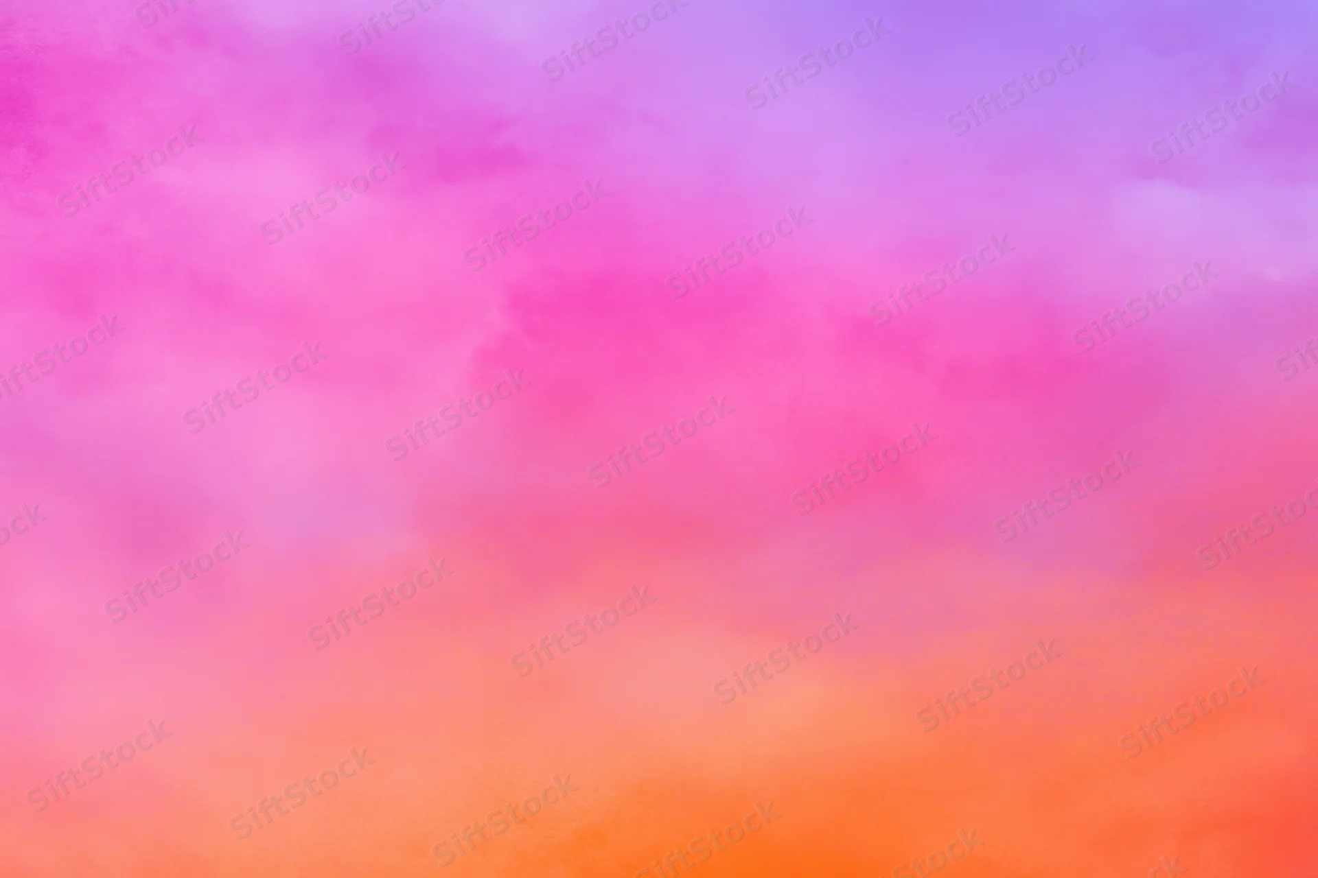 Soft gradient of pink purple and orange blending across the sky