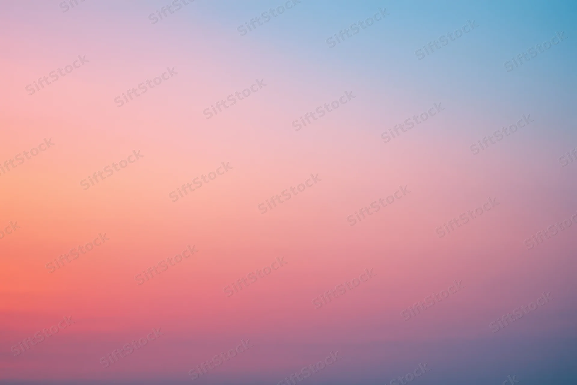 Soft pastel gradient sky blending pink and blue at dusk