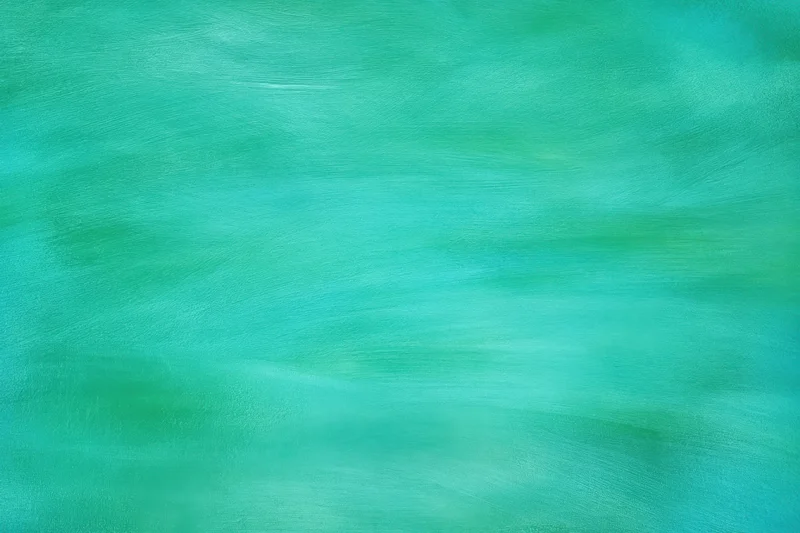 Teal-green painted backdrop with visible brush strokes and soft texture