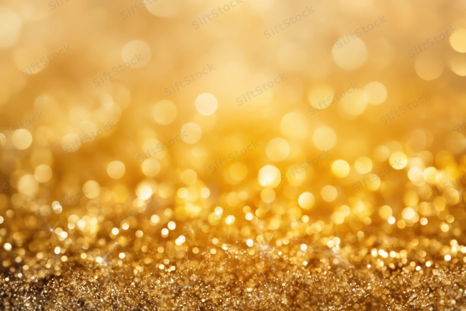 Golden glitter with shimmering bokeh lights across the frame