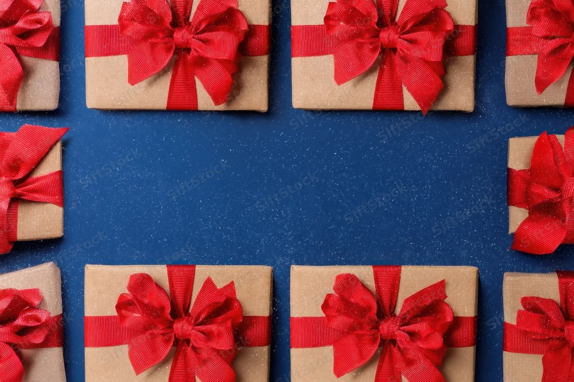 Wrapped gifts with red bows arranged in a frame on a blue background