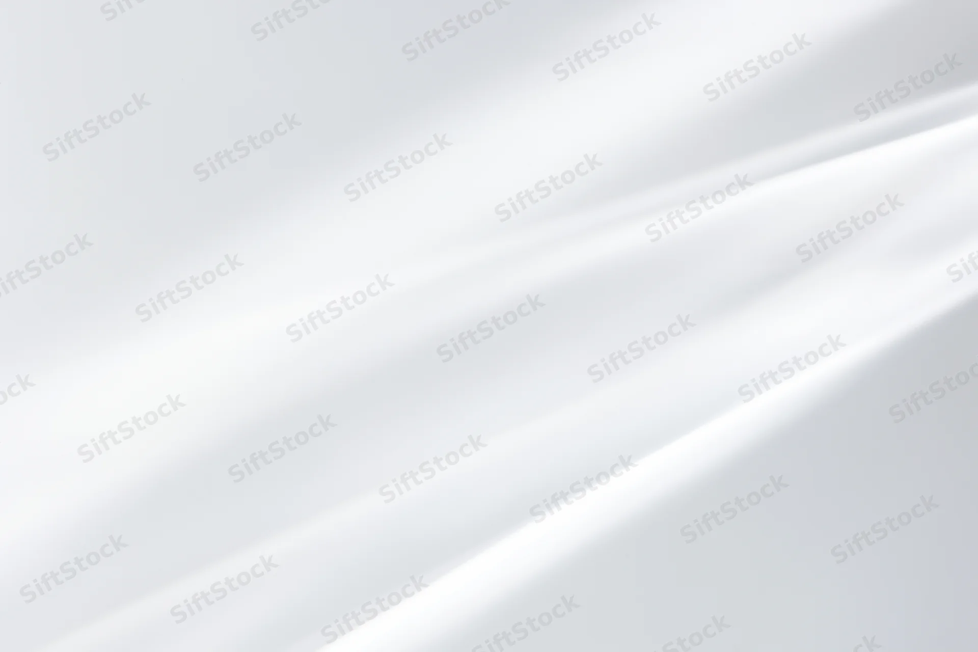 Soft diagonal light streaks on a bright white minimal background