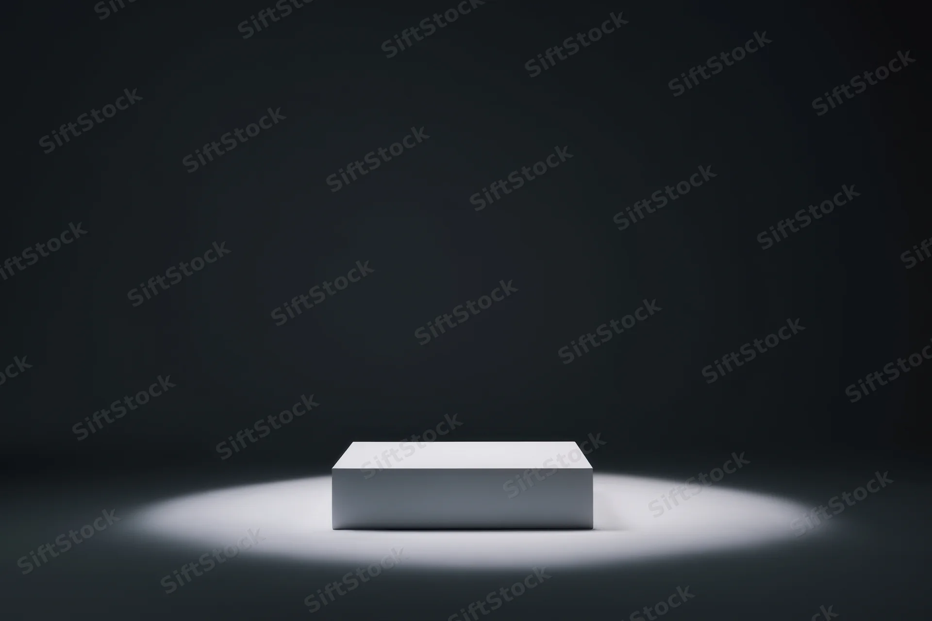 White rectangular pedestal centered under spotlight on dark stage