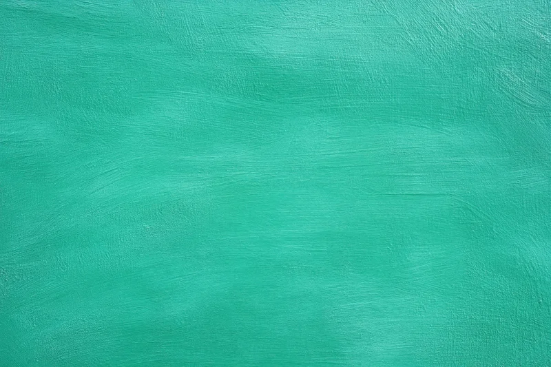 Teal painted surface with visible brush strokes as abstract background