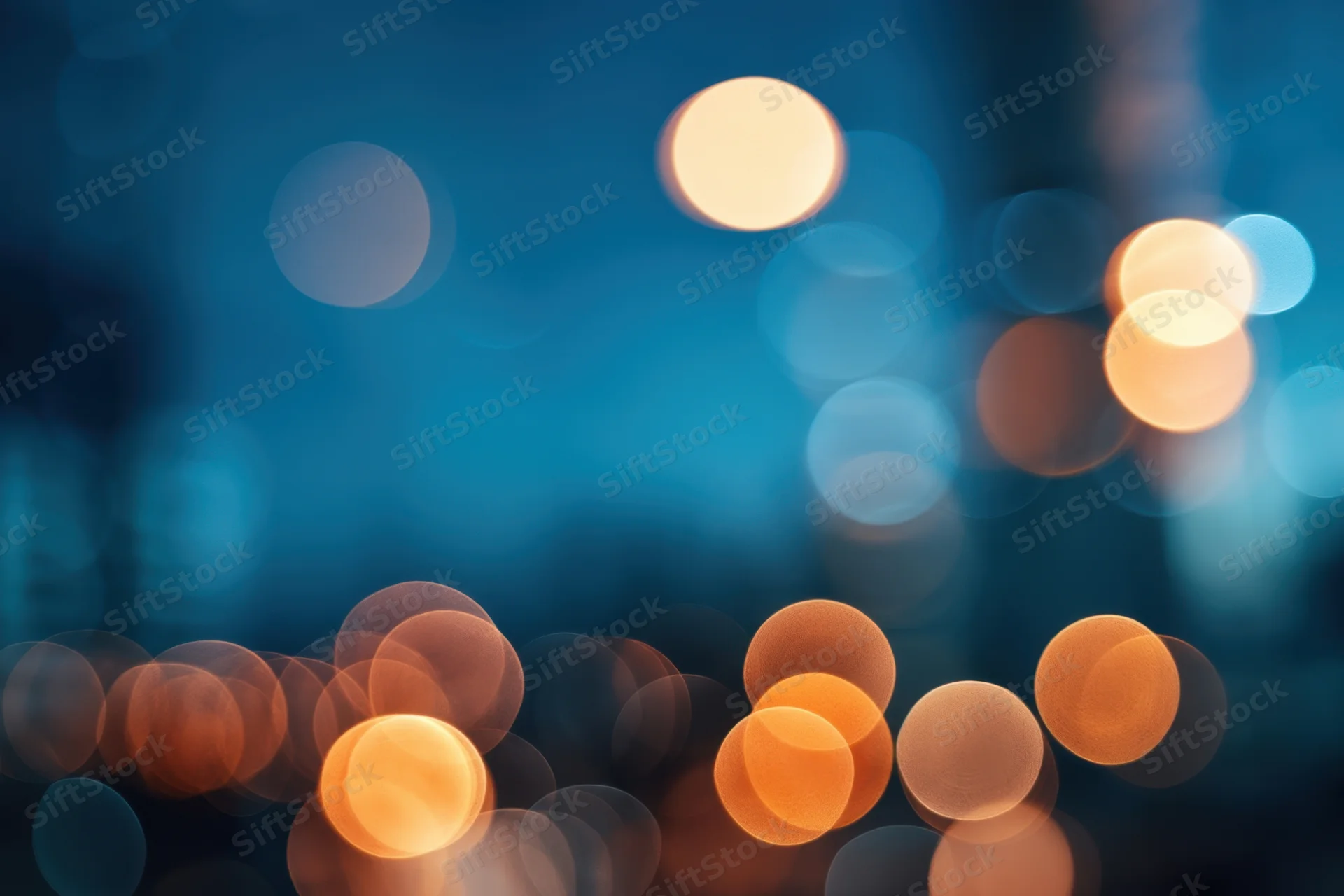Blurred city lights at night with warm and cool bokeh circles