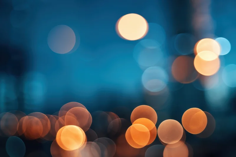 Blurred city lights at night with warm and cool bokeh circles