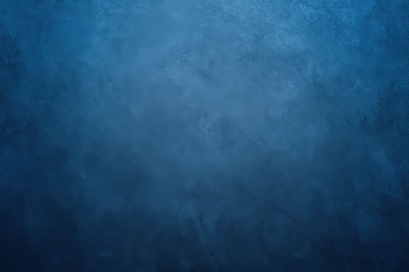 Dark blue grunge textured backdrop with subtle gradient and mottled surface