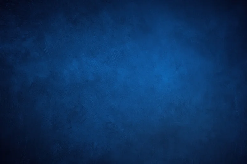 Dark blue grunge textured backdrop with subtle gradient