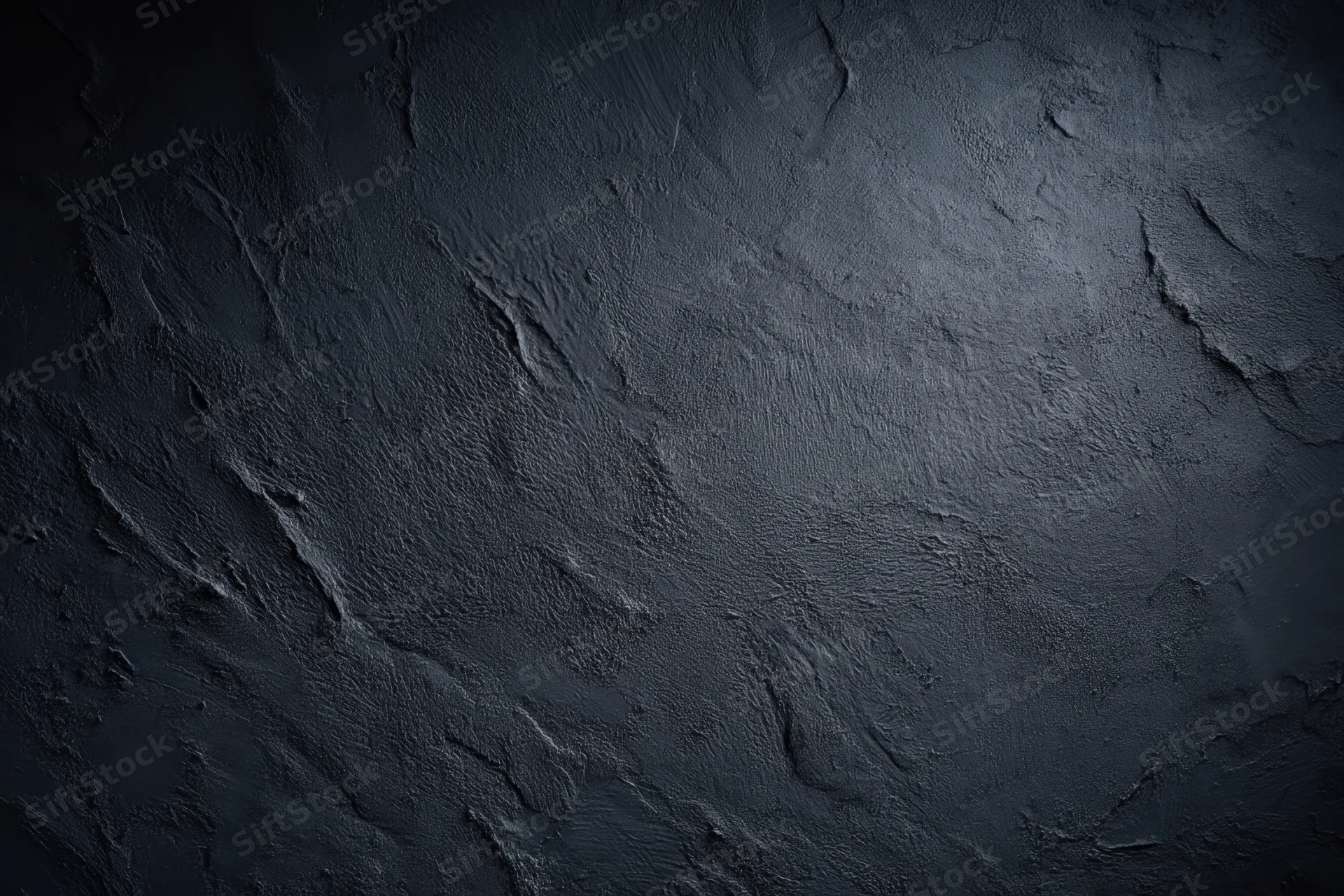 Dark textured concrete surface with rough uneven finish