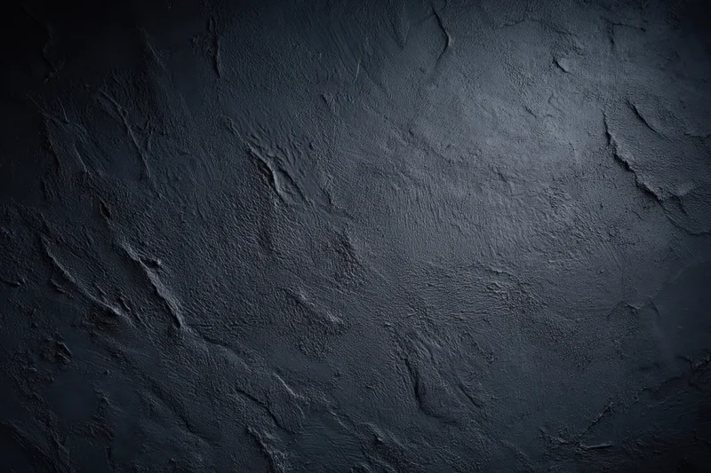 Dark textured concrete surface with rough uneven finish