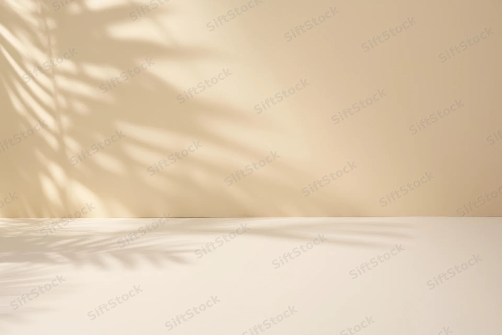 Minimalist interior with palm leaf shadows on beige wall and floor