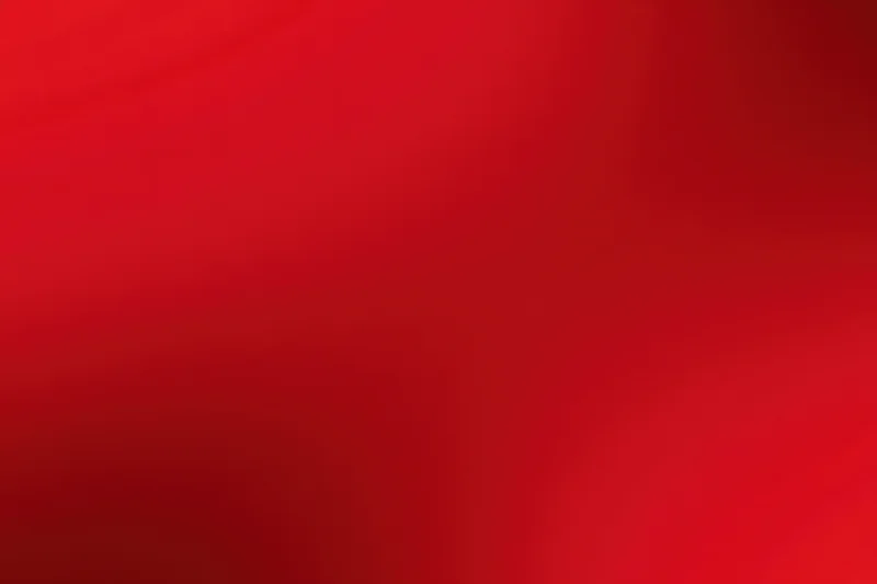 Smooth crimson-red gradient background with gentle vignette effect
