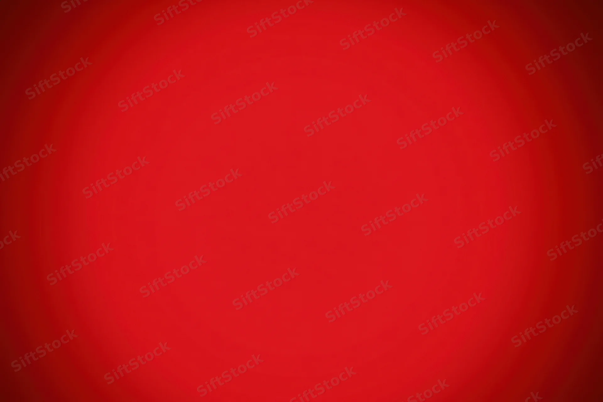 Smooth crimson red gradient background with radial vignette effect