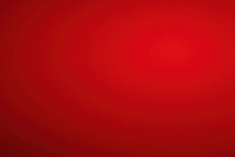 Smooth crimson-red gradient background with gentle vignette effect